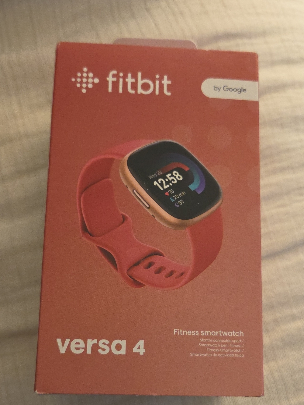 fitbit Versa 4 Smartwatch - Coral/Gold Case